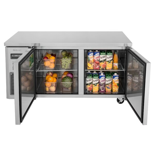 A Turbo Air J Series undercounter refrigerator with a door open containing oranges.