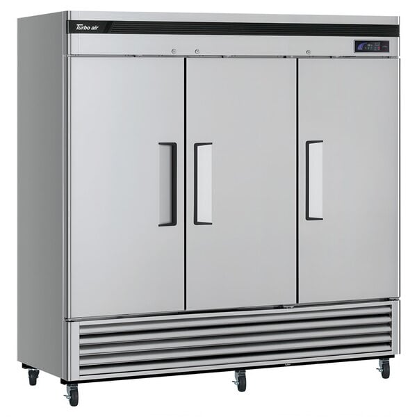 A large silver Turbo Air reach-in refrigerator with three doors.