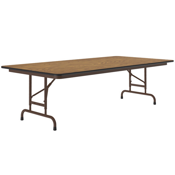 A rectangular Correll medium oak folding table with a metal frame.