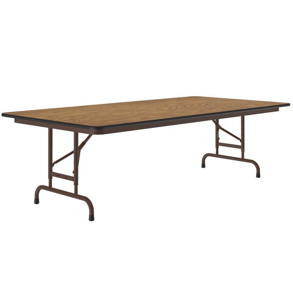 A Correll rectangular folding table with a medium oak top and metal frame.