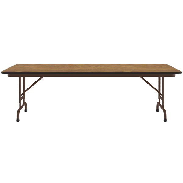 A Correll medium oak rectangular folding table with a metal frame.