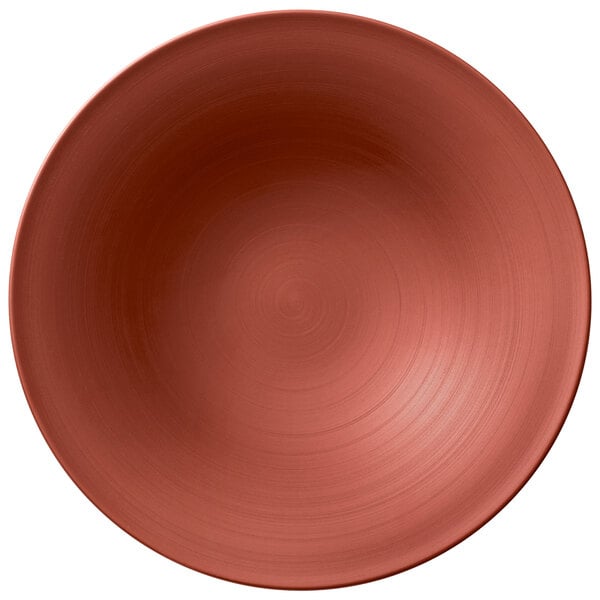 A Villeroy & Boch Copper Glow shallow plate with a red spiral pattern on a white background.