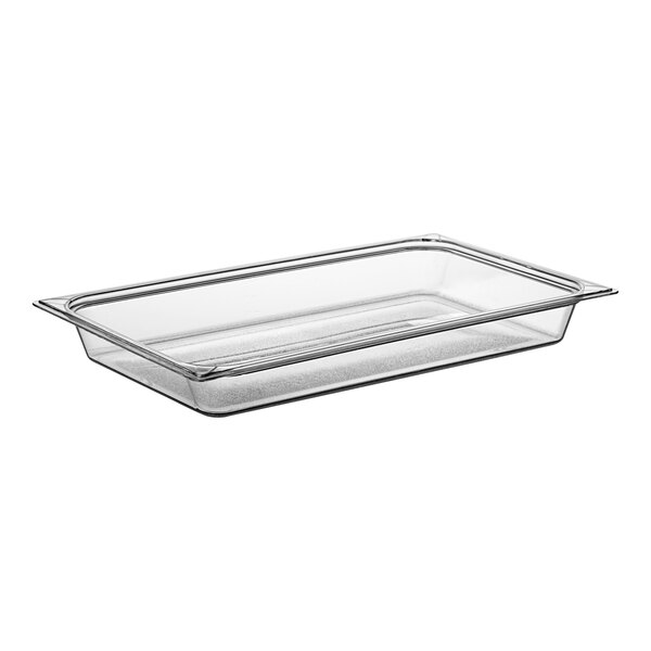 A Carlisle clear plastic food pan on a counter.