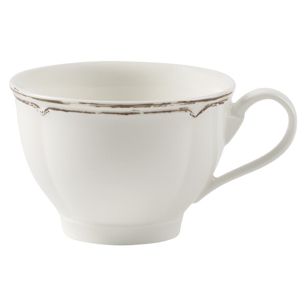 A white Villeroy & Boch porcelain cup with silver trim.