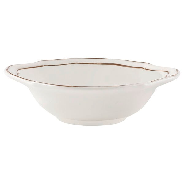 A white Villeroy & Boch porcelain bowl with gold trim.