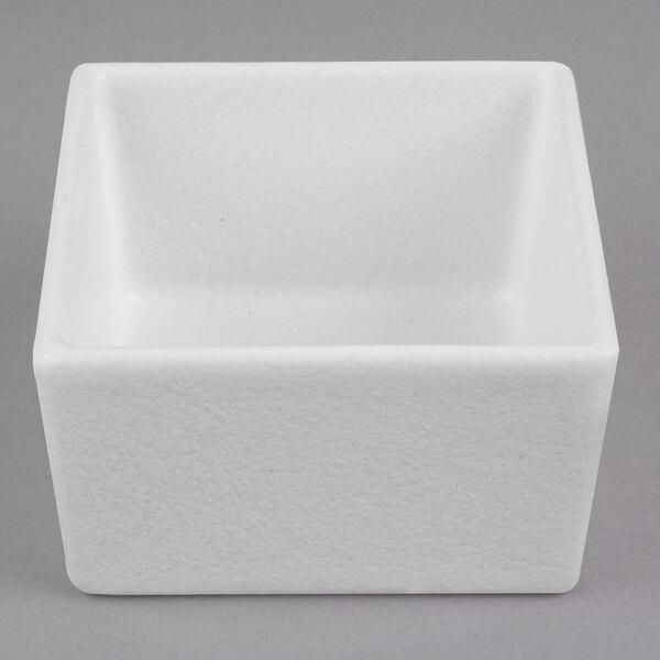 A white square G.E.T. Enterprises Bugambilia salad bowl.