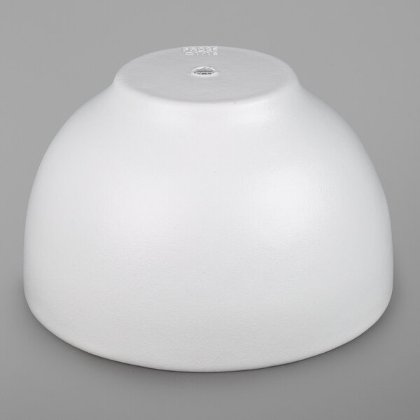 A G.E.T. Enterprises white resin-coated aluminum bowl on a gray surface.