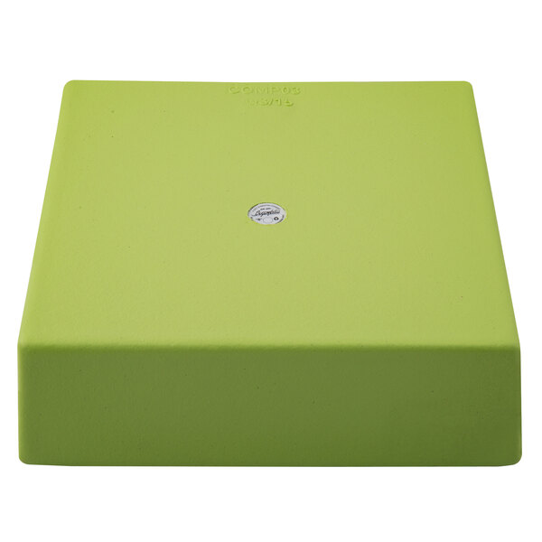 A lime green square bowl with a white circle on it.