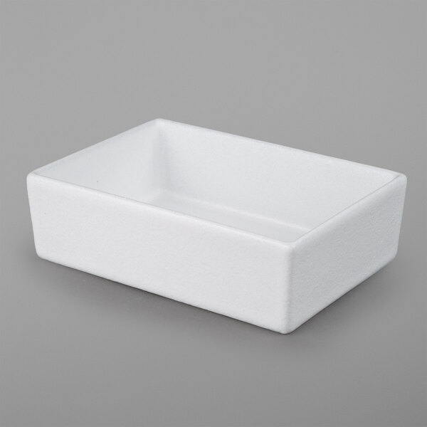 A white rectangular G.E.T. Enterprises Bugambilia salad bowl.