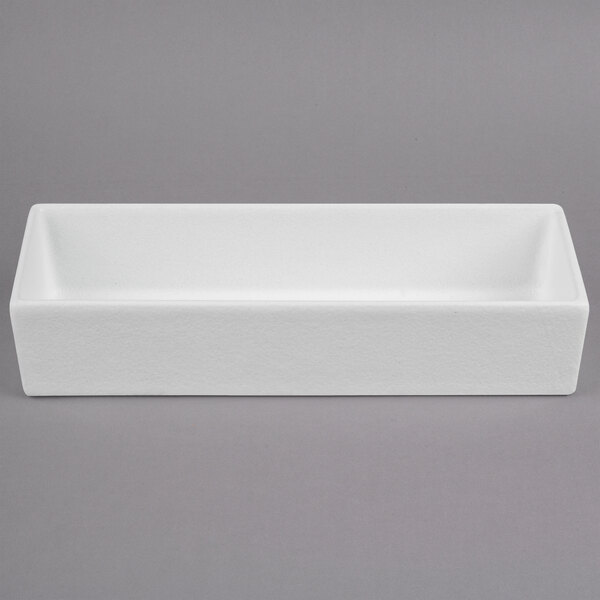 A white rectangular G.E.T. Enterprises salad bowl on a gray surface.