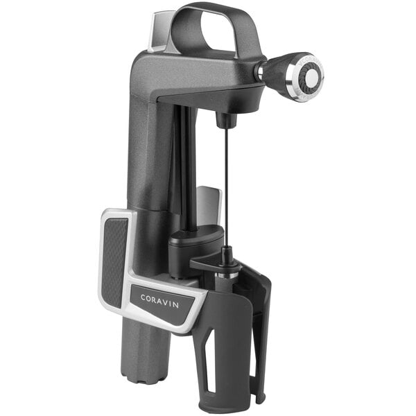 A black and silver Coravin wine bottle opener.