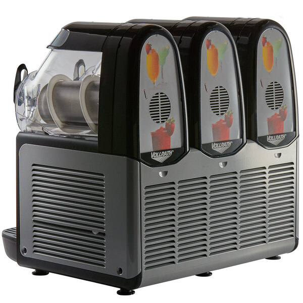 A Vollrath frozen beverage machine with three different flavors.