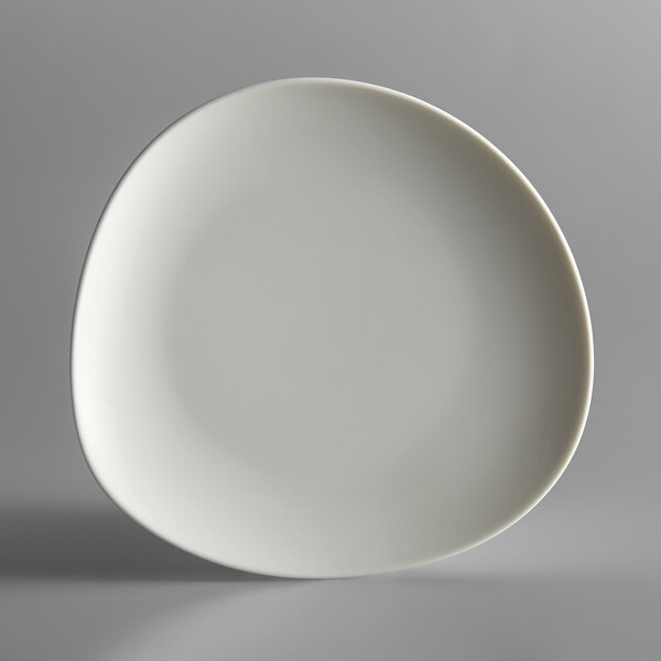 A Schonwald cream porcelain plate with a small rim.