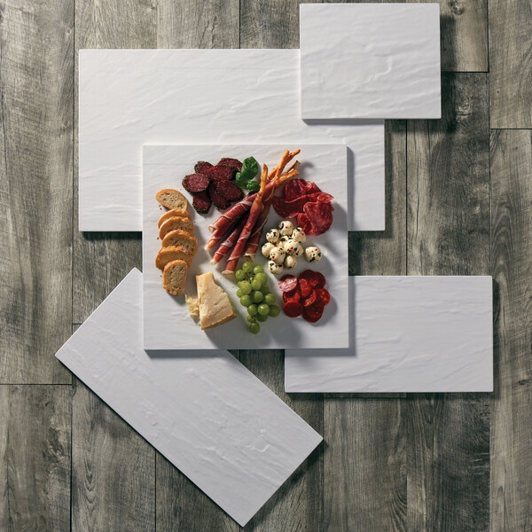 a group of white rectangular objects on a wood surface