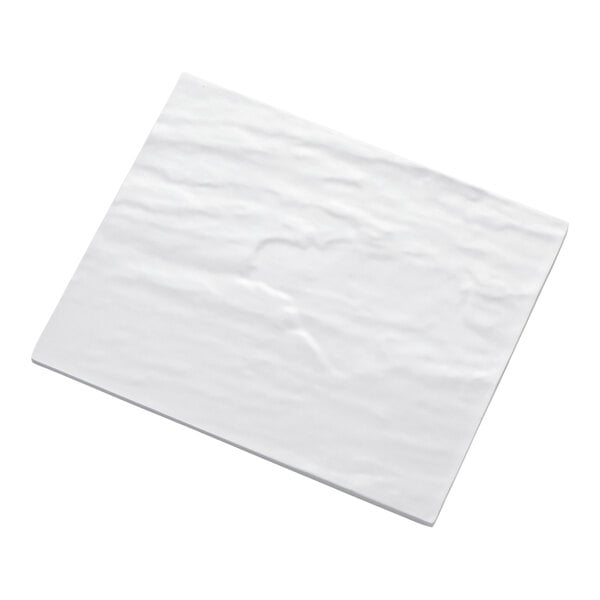 A rectangular white platter with a slightly textured surface.