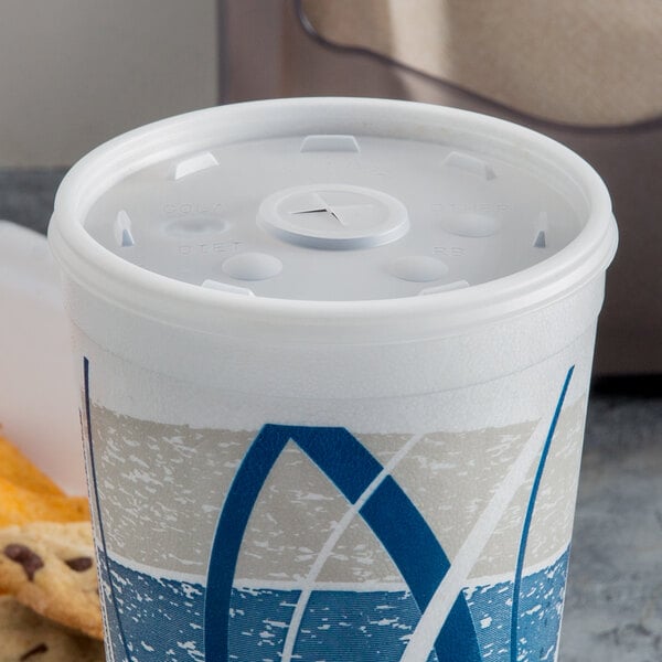 a white plastic container with a hole in the lid