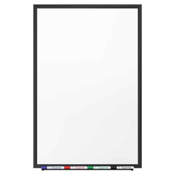 A Quartet whiteboard with a black frame and markers on it.