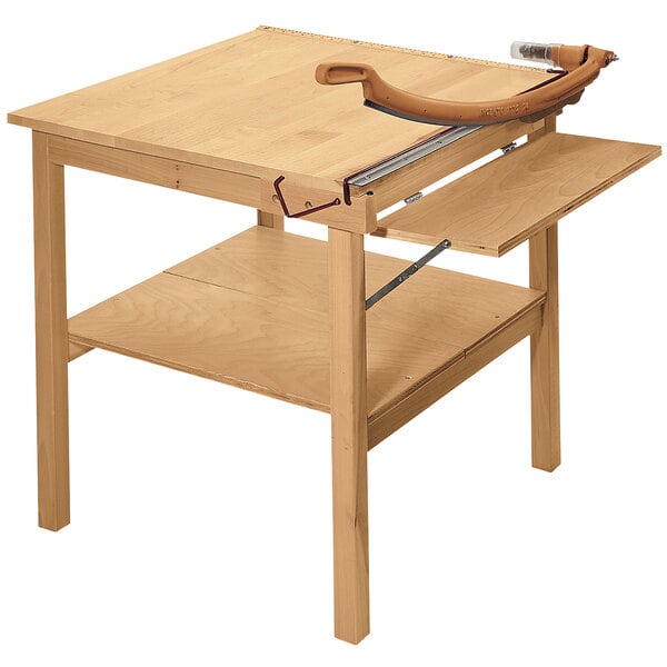 A Swingline ClassicCut guillotine paper trimmer on a wooden table.