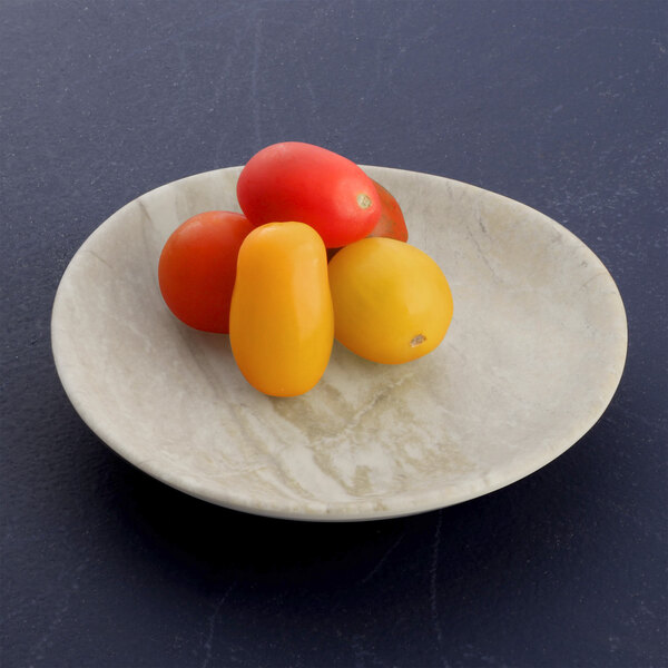 A plate of tomatoes on a sandstone Elite Global Solutions plate.
