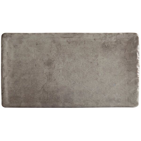 A rectangular grey stone surface.