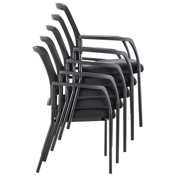 A stack of four Alera black mesh guest chairs with arms.