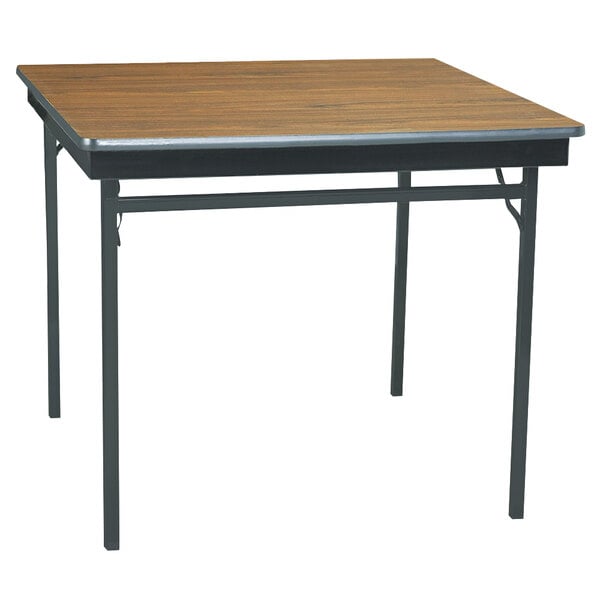 A square Barricks folding table with a walnut top and black metal legs.