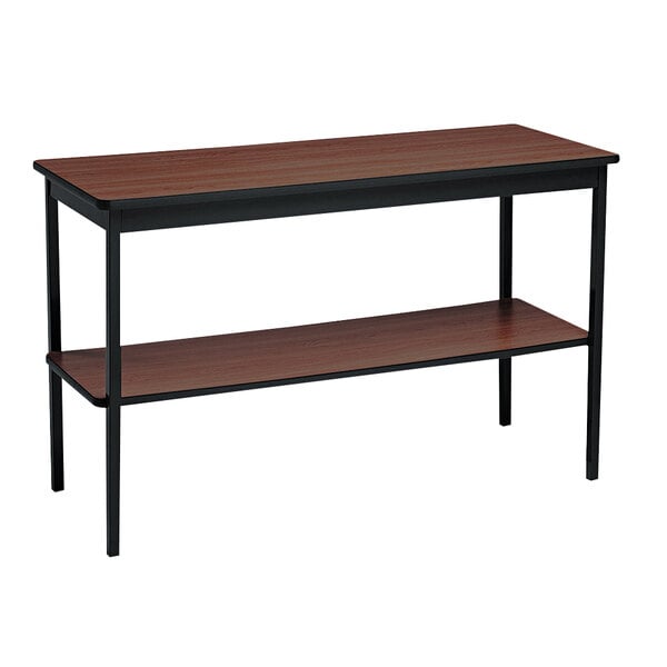 A Barricks walnut and black rectangular utility table with a shelf.
