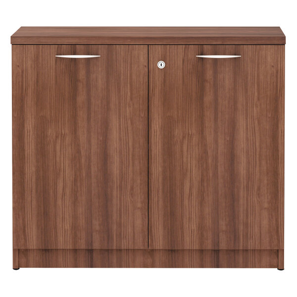 a brown cabinet with silver handles