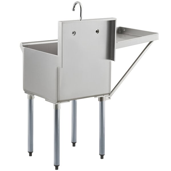 A Steelton stainless steel utility sink with faucet and drainboard.