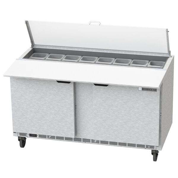 A Beverage-Air commercial sandwich prep refrigerator with clear lids on the counter.