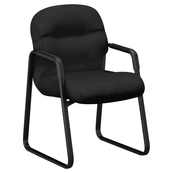 A black HON Pillow-Soft managerial guest chair with arms.