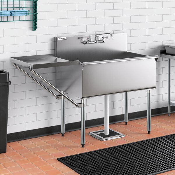 A Steelton stainless steel utility sink with faucet.