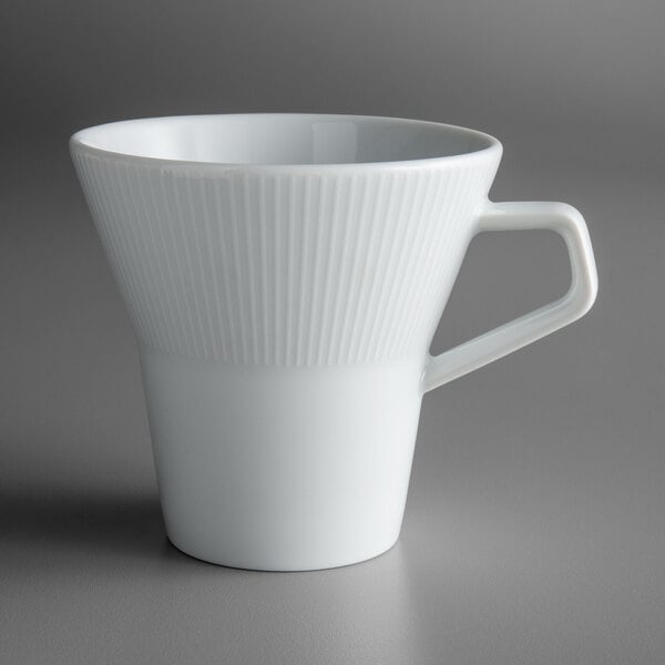 A Schonwald Continental White porcelain tall cup with a handle.