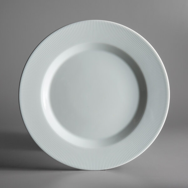 A Schonwald Continental white porcelain plate with a ribbed rim.