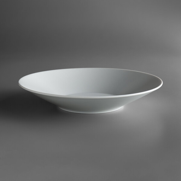 a white bowl with a shadow