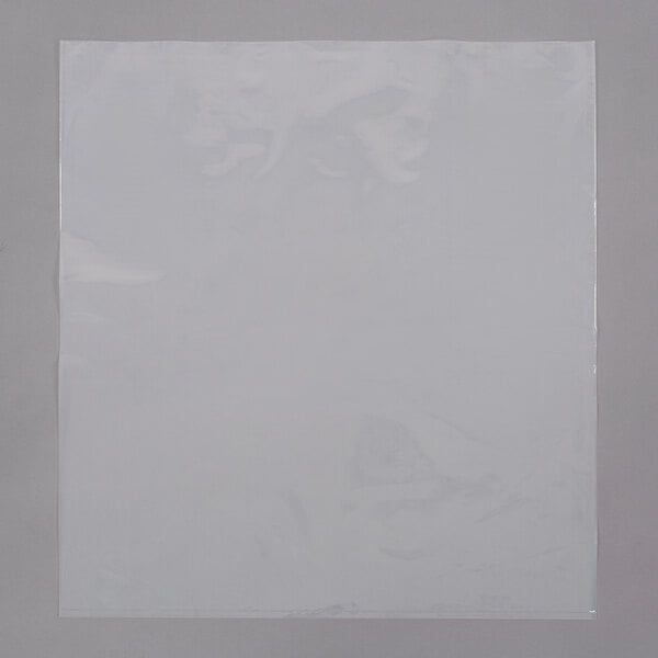 A white plastic bag on a gray surface.
