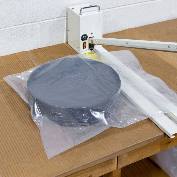 a stack of round black objects in a plastic bag