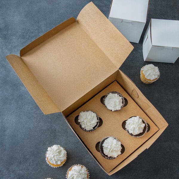 A Baker's Mark kraft cupcake box with cupcakes in it with a white background.