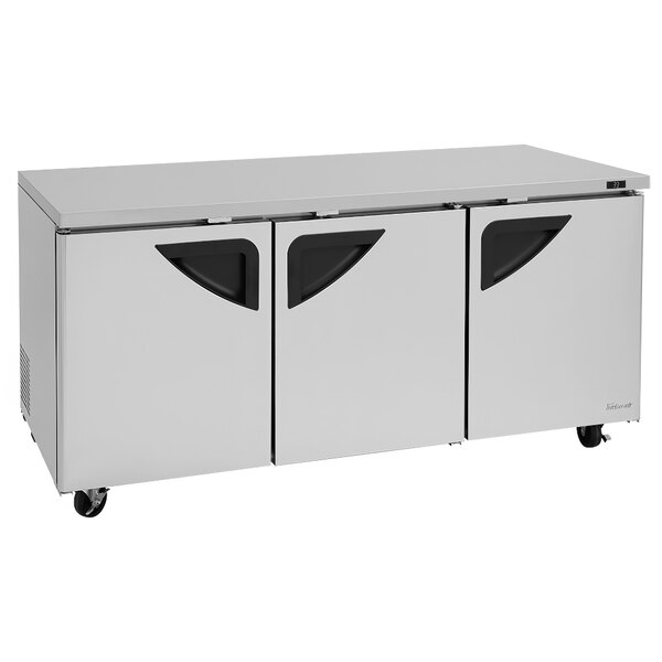 A white Turbo Air undercounter refrigerator with black handles.