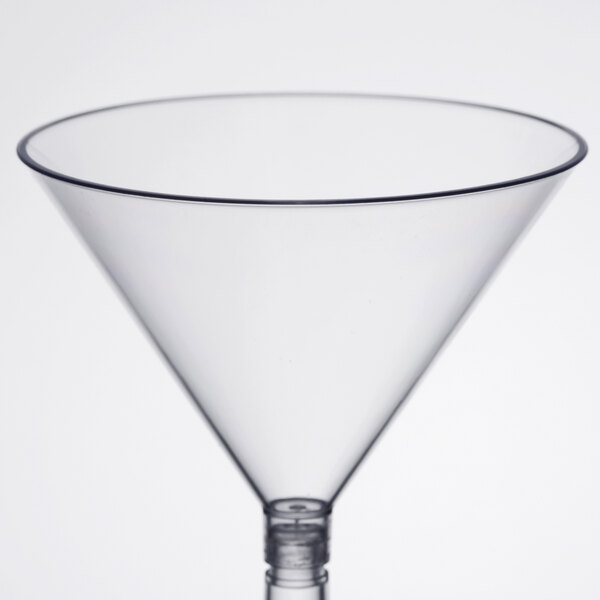 A clear plastic martini glass with a stem.
