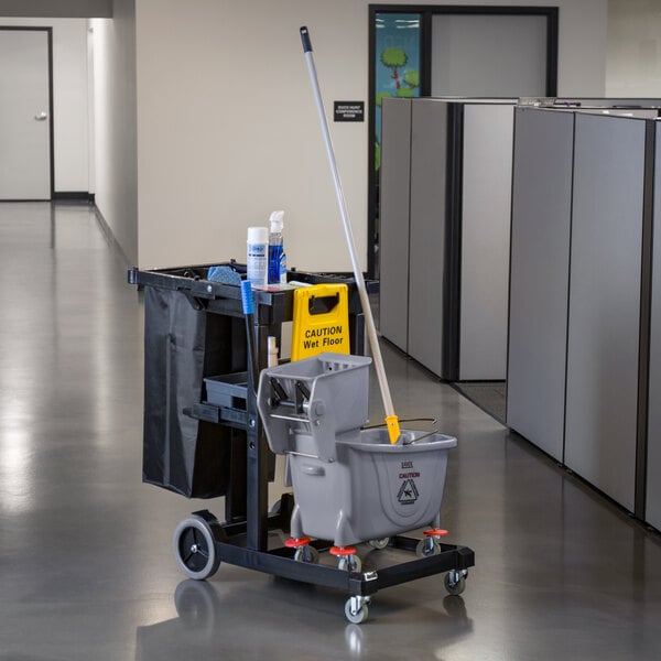 A Lavex janitor cart with a mop bucket and caddy on wheels.