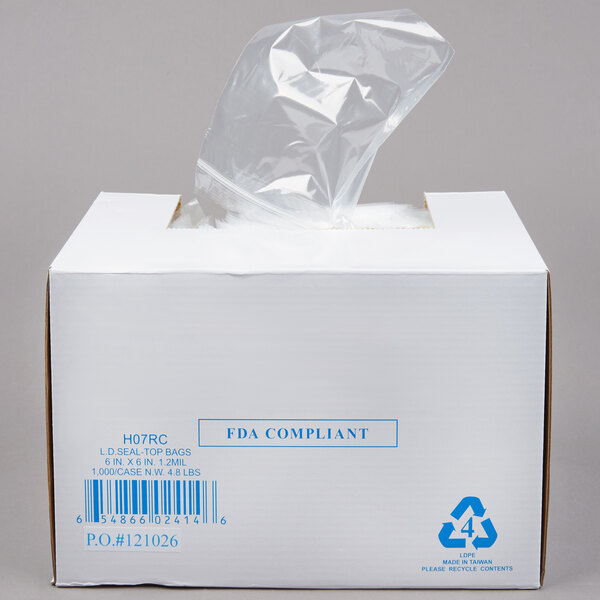 A white box with a clear plastic bag of 6" x 6" Seal Top Plastic Food Bags inside.