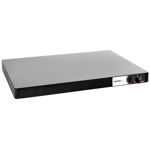 A rectangular electronic Nemco Heated Shelf Warmer with black sides.