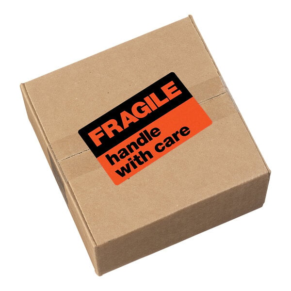 A brown cardboard box with a neon red label that reads 'FRAGILE handle with care.'