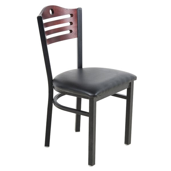 A black chair with a wooden back and black leather seat pad.