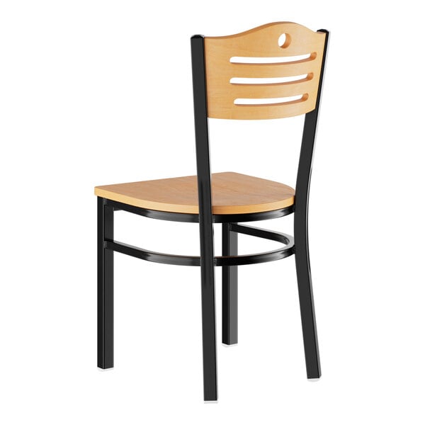 A standard height dining chair with a natural wood seat and backrest, featuring a black metal frame.