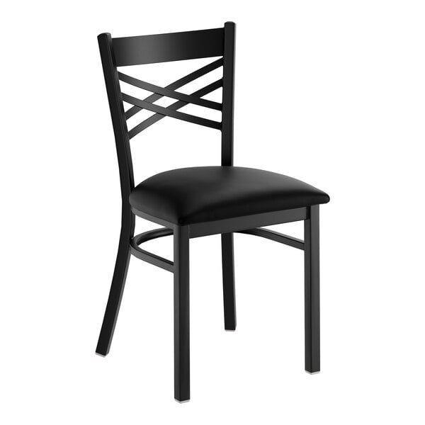 A black cross back dining chair with a padded seat.