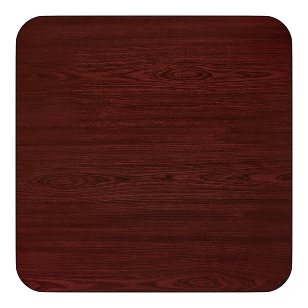 A square, reversible cherry and black table top with a wood grain finish and rounded corners.
