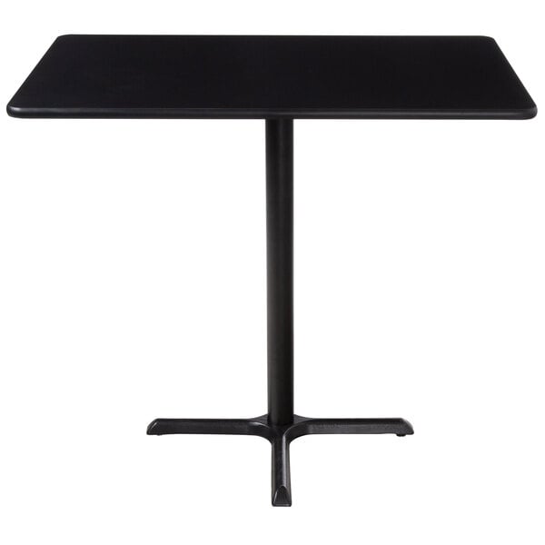 A black rectangular table with a metal base.
