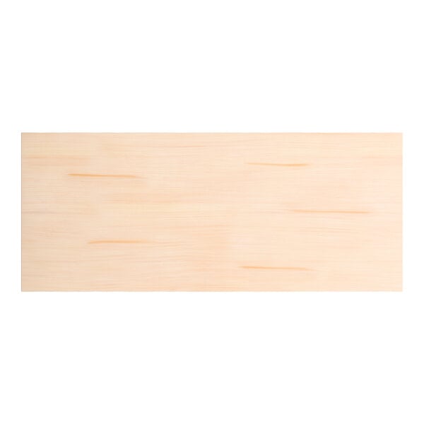 A rectangular solid wood table top with a bleached oak finish and a live edge design.